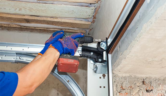 A person installing electrical wire