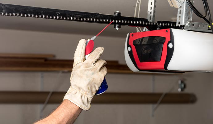 Lubricating garage door opener chain