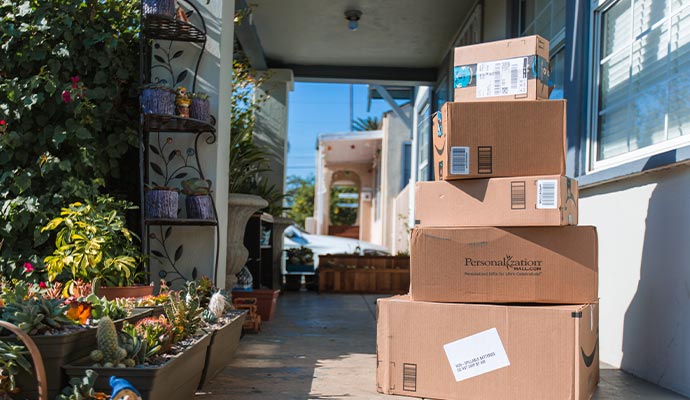 Stacked delivery boxes on porch