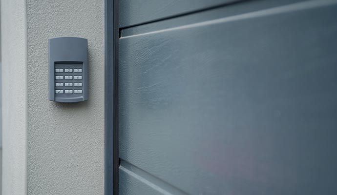 Exterior garage door opener keypad mounting