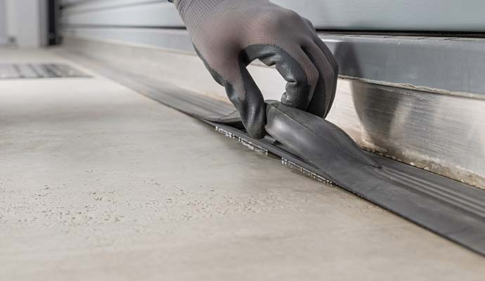 Expert upgrading garage door seal