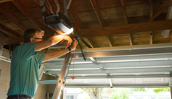 An expert repairing garage door opener