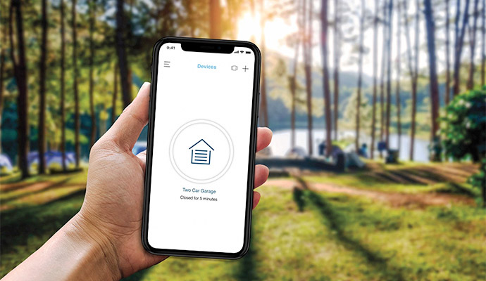 Smartphone displaying smart garage door monitoring application