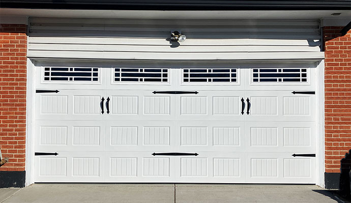 White carriage style steel garage door
