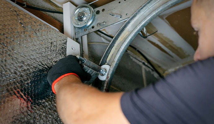 An installed new garage door roller