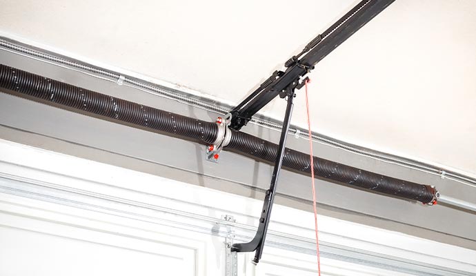 Garage door opener rail and trolley arm assembly