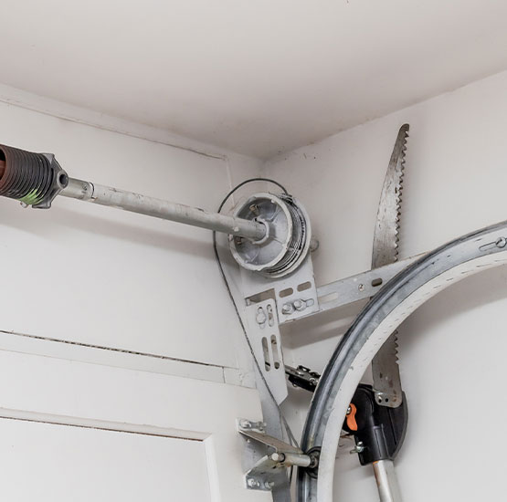 A metal torsion spring and cable drum assembly