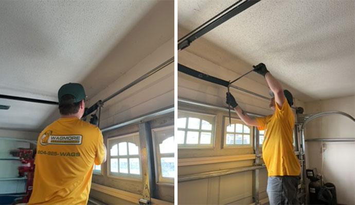 A professional technician adjusting the torsion spring and upper track assembly to fix a garage door operation issue