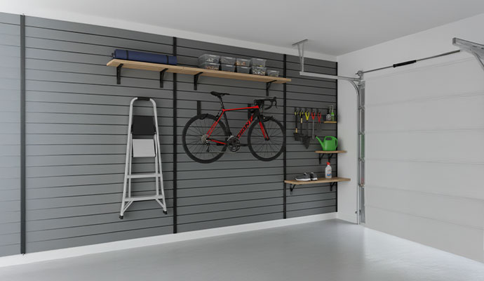 Organized garage with slat wall system equipped with various accessories