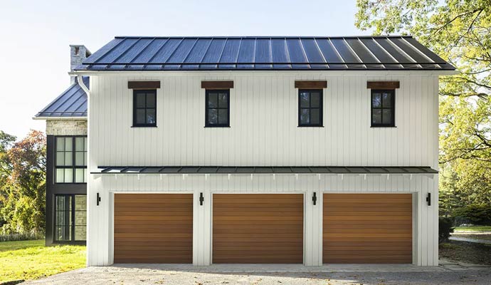 Modern farmhouse three car wood garage doors