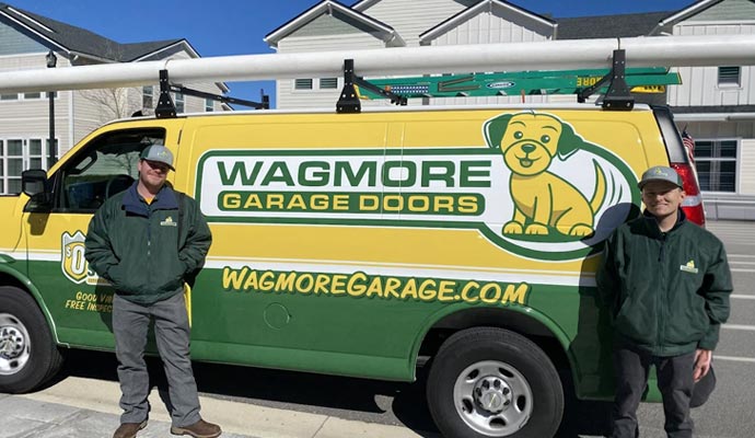 Wagmore Garage Doors team members with their service van